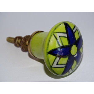 pastel green pear-shaped button and ultramarine flower