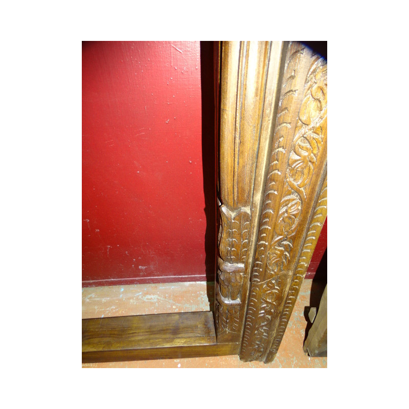 Old house doors in the shape of an arch carved...