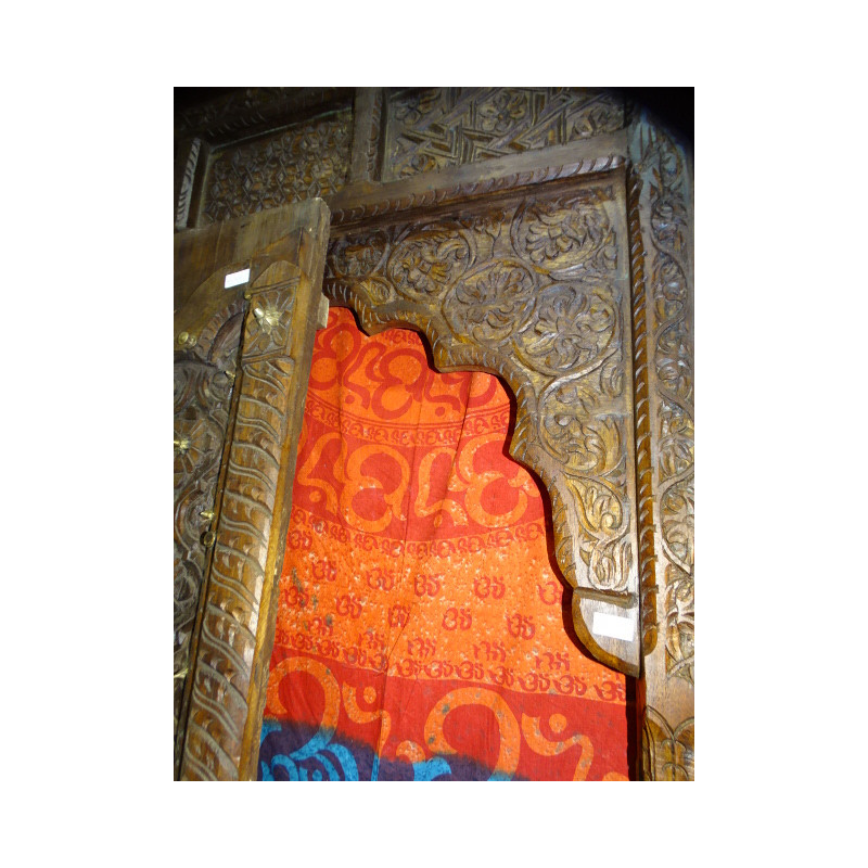 Old house doors in the shape of an arch carved...