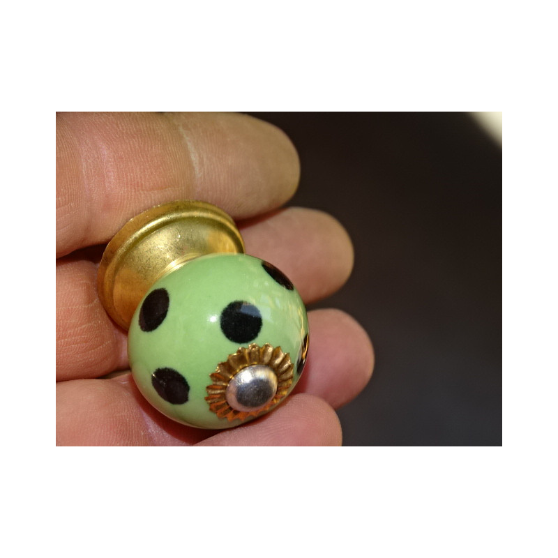 Small green handles with black dots
