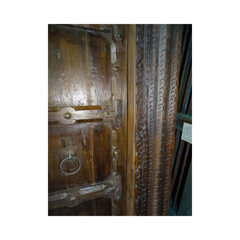 Patinated house door in dark