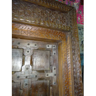 Patinated house door in dark with steel fittings