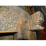 Very old low door of Indian house with coat hook