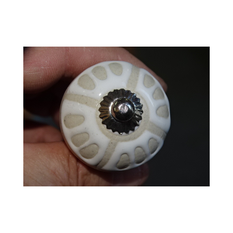Furniture knobs with four trios of raised dots...