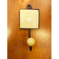 yellow square door hook with white circles
