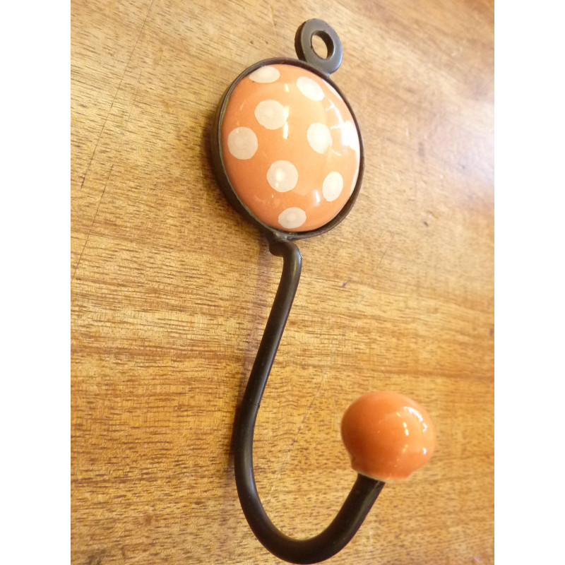 Porcelain hook with orange color and white...