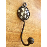 Black round ceramic hook with white polka dots