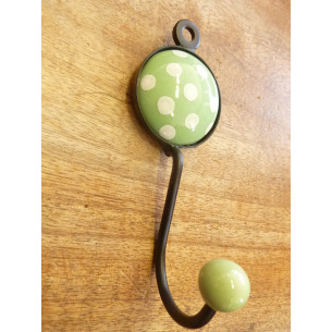 coat with one hanger a light green round  with white dots