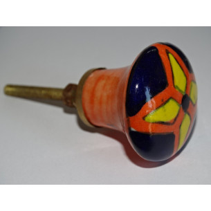 orange pear shaped button and yellow and ultramarine flower