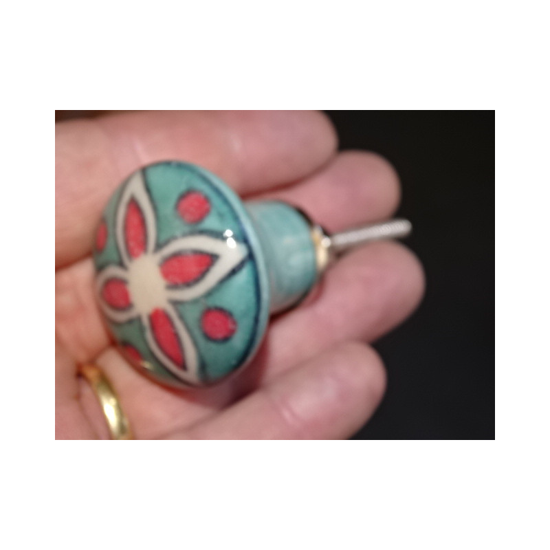 turquoise green pear-shaped button and red flower